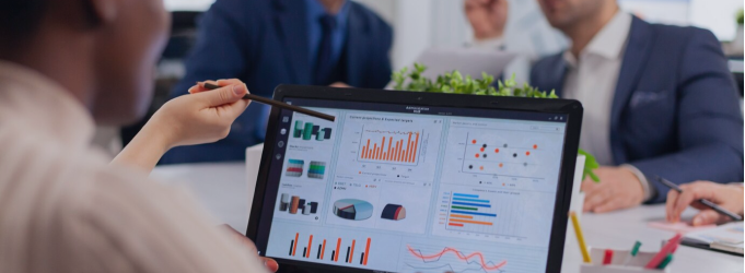 Digital team reviewing project growth and discussing strategies during an in-person briefing