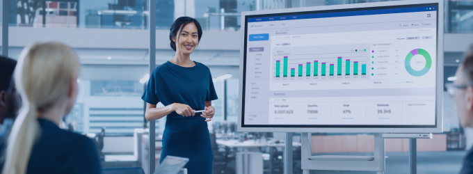 Data analyst presenting business intelligence dashboard insights to IT team