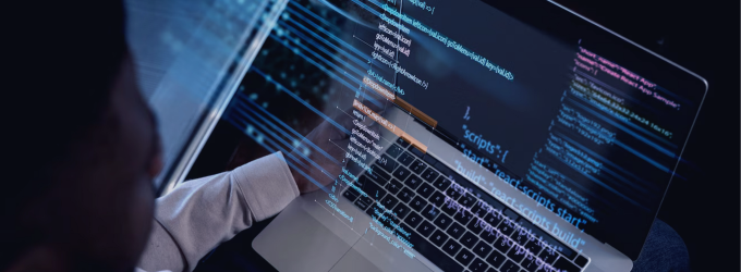 Developer working on complex system architecture with frontend and backend code displayed on screen