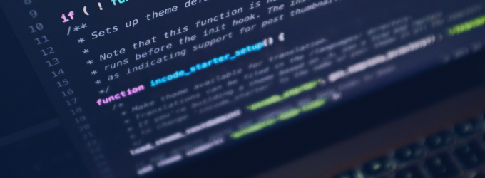 Programmer working on backend system integration, viewing annotated code lines on a screen