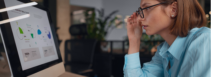 Busines analyst examines customer engagement infographics to identify improvement opportunities.