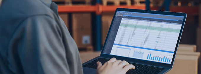 Operations team manager audits real-time logistics data to optimize warehouse performance.
