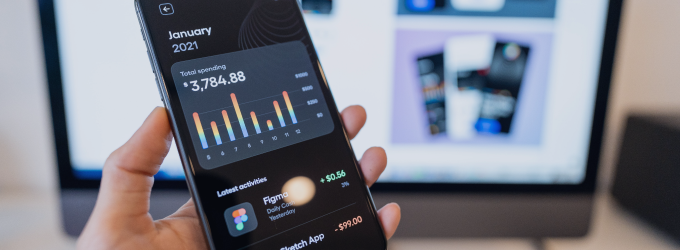 Product team member analyzing financial performance and user statistics on a tablet app