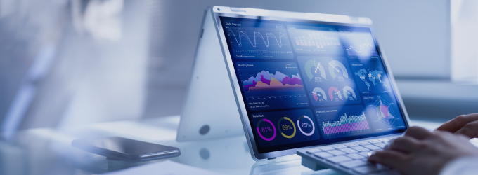 Reviewing business dashboards and data charts on a tablet during a strategy session