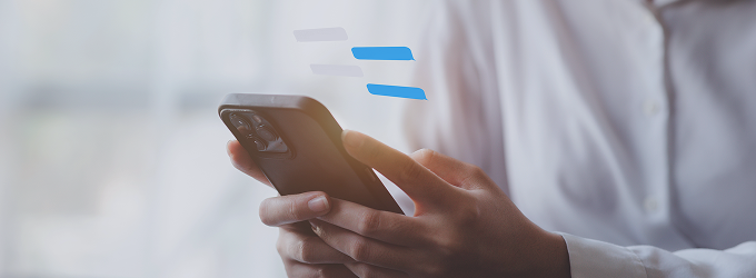 Team member engages in real-time project discussions using a corporate messaging platform on their phone.
