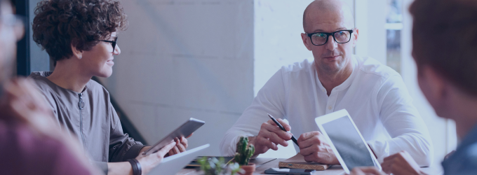 IT professionals sharing insights and planning software features in a creative workspace