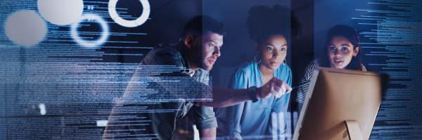 The consulting team reviews analytics on screen, focusing on data-driven IT strategy and solutions