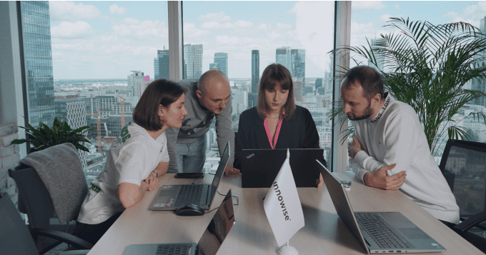 Focused product team holding a brainstorming session in a modern workspace
