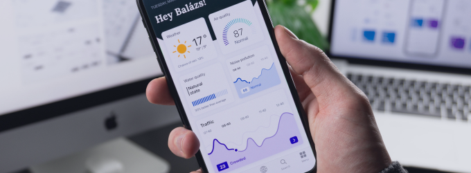 Business analyst checks real-time usage and conversion graphs on a mobile insights platform.