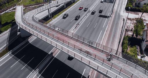 Modern highway with a tech-enabled cycle bridge supports digital mobility and traffic flow optimization