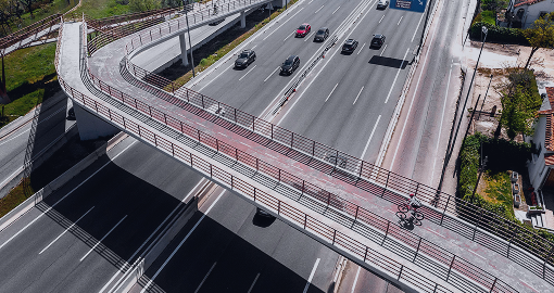 Modern highway with a tech-enabled cycle bridge supports digital mobility and traffic flow optimization