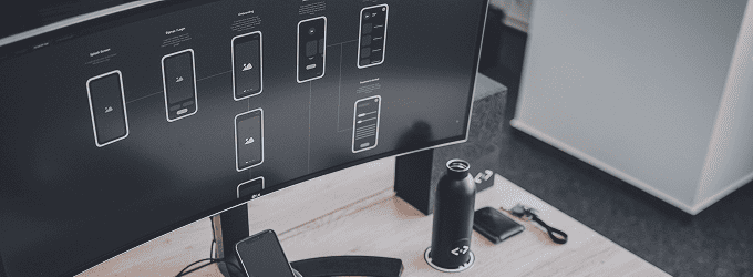 Reviewing mobile wireframes and app navigation flows on a large screen