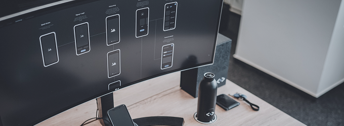 Reviewing mobile wireframes and app navigation flows on a large screen