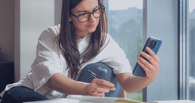 Learner using an EdTech mobile learning app.